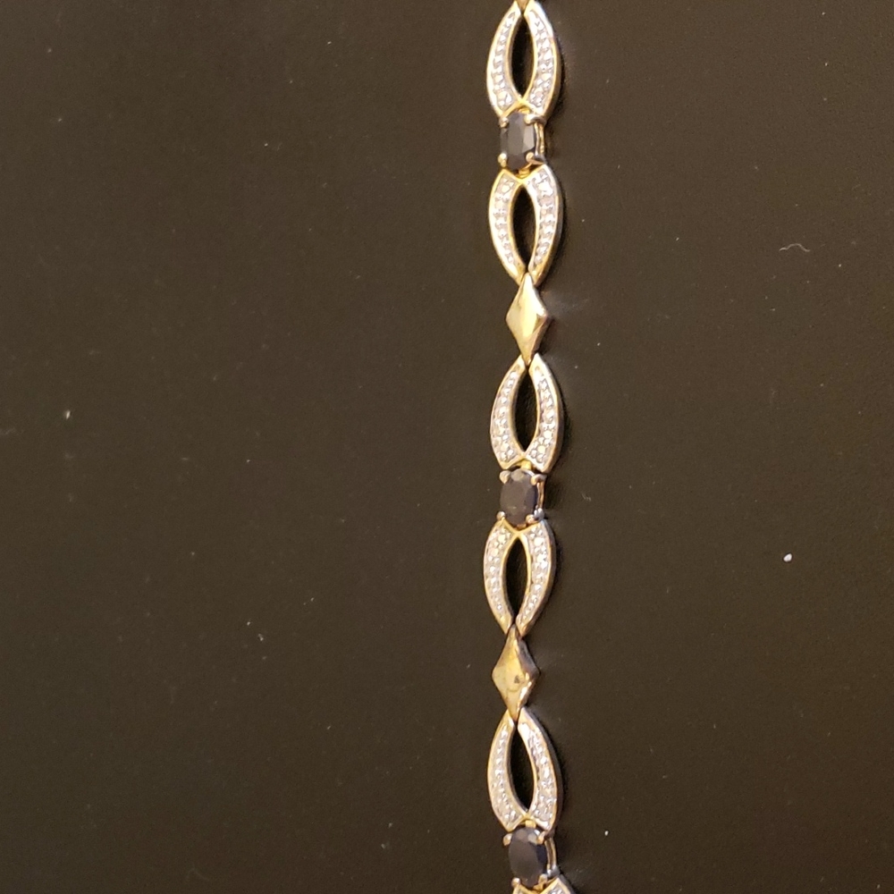 18K Gold bracelet with diamonds and sapphires. (7.5 inches long)